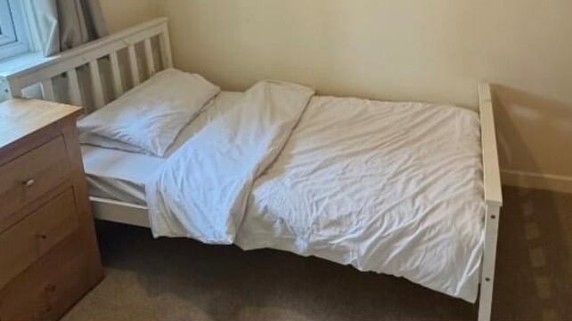 White wooden single bed 