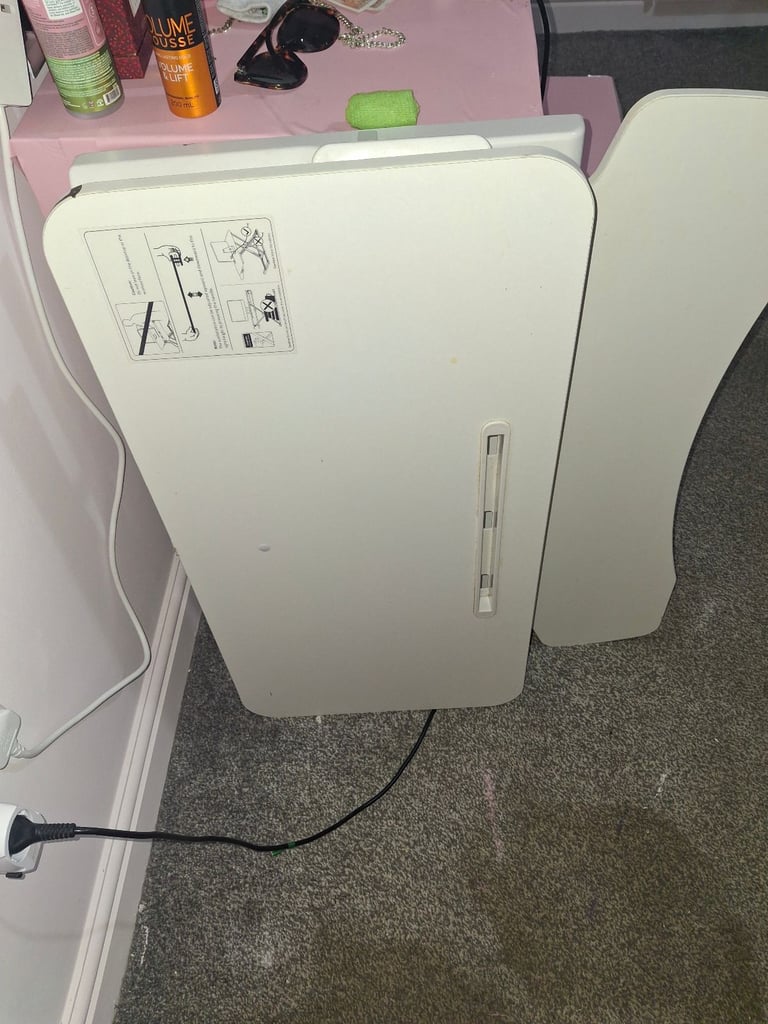 2 black arm chairs, standing up extender for desk and a pink desk with stool.