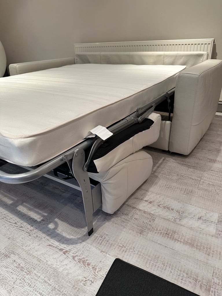Natuzzi (Brand) cream leather sofa bed 