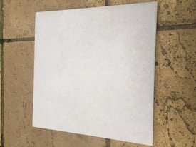 20 Grey Floor tiles and 1 bag of grey adhesive 