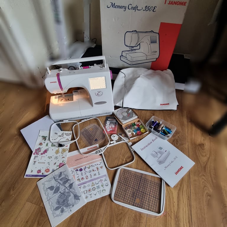 Janome embroidery sewing machine with instructions and accessories 