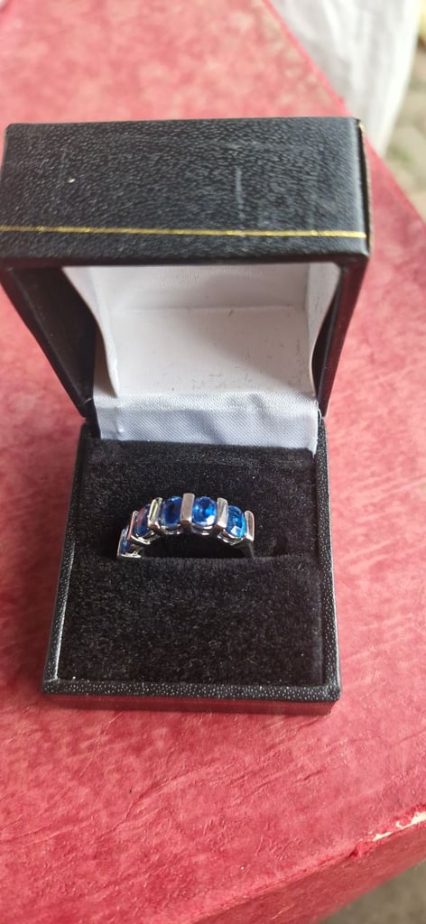 Silver and blue topaz ring