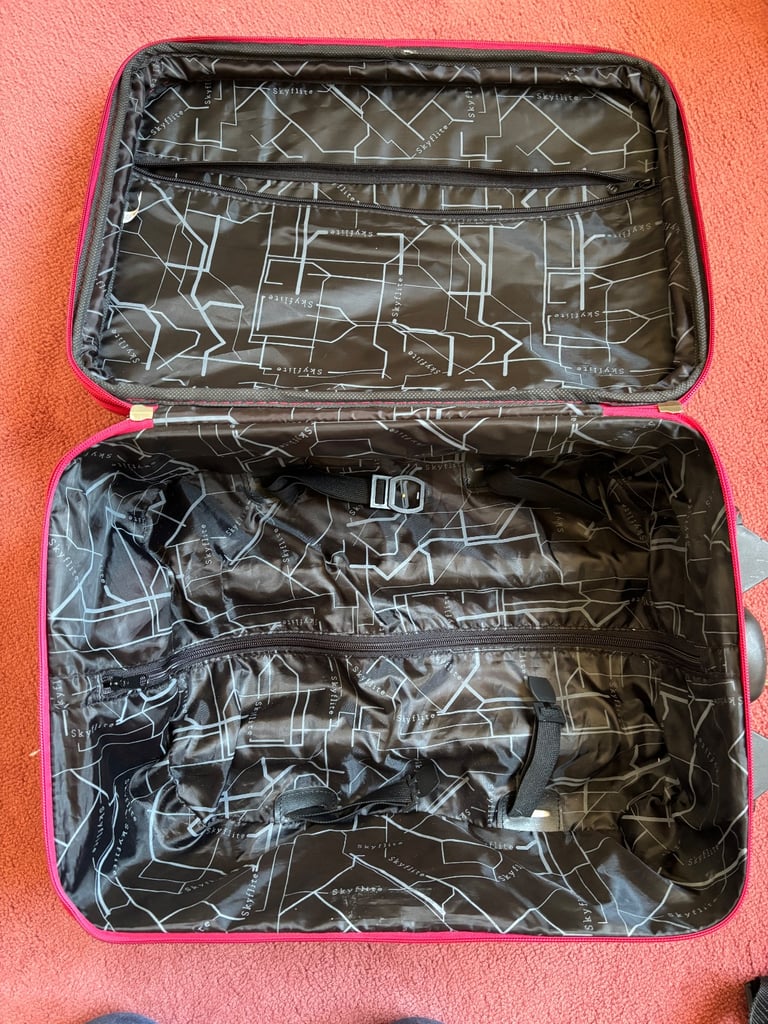 Small suitcase with wheels and extending handle