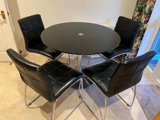 image for Black Circular Glass Top Table 100cm Diameter with Chrome Base and four Matching Chairs