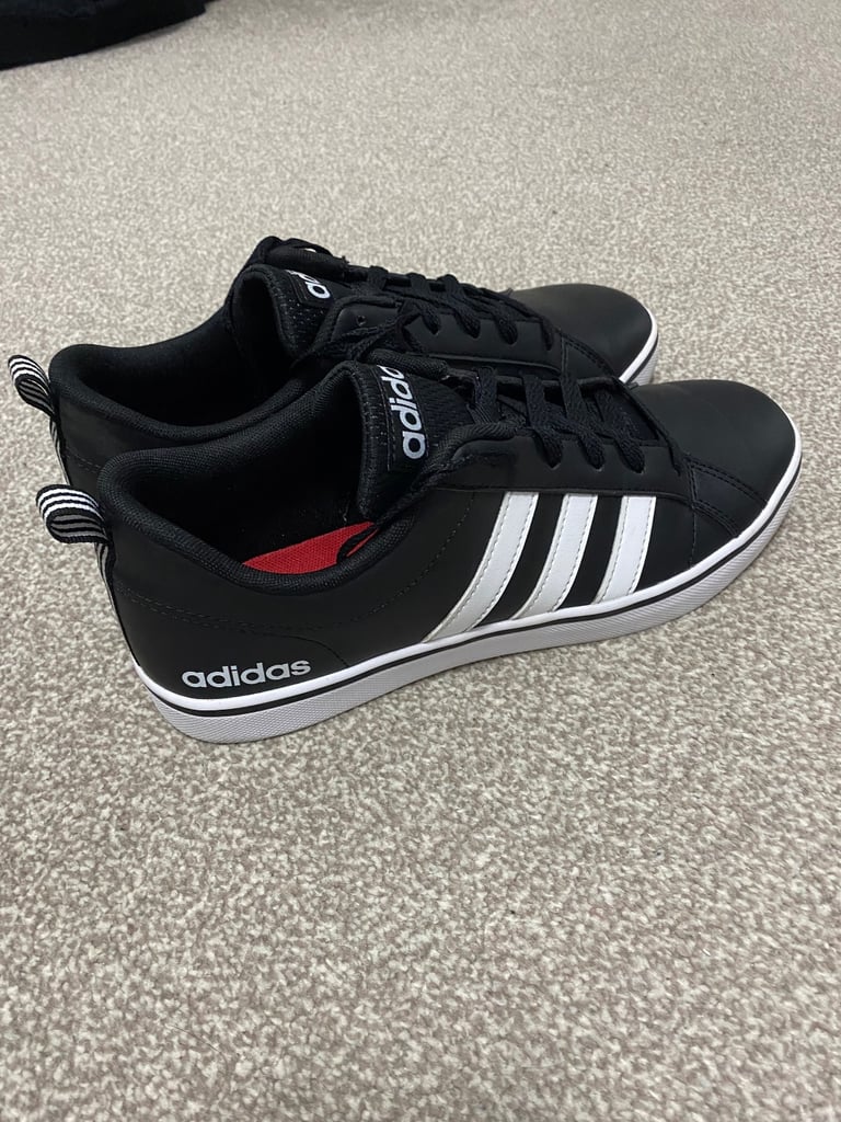 image for Black and white adidas trainers