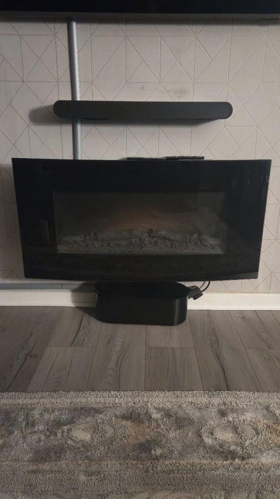 image for Blyss Dovhy 1.8kW Black Glass effect Wall-mounted Electric Fire (H)550mm (W)1000mm (D)150mm