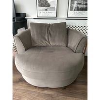 Velvet grey swivel snuggle armchair
