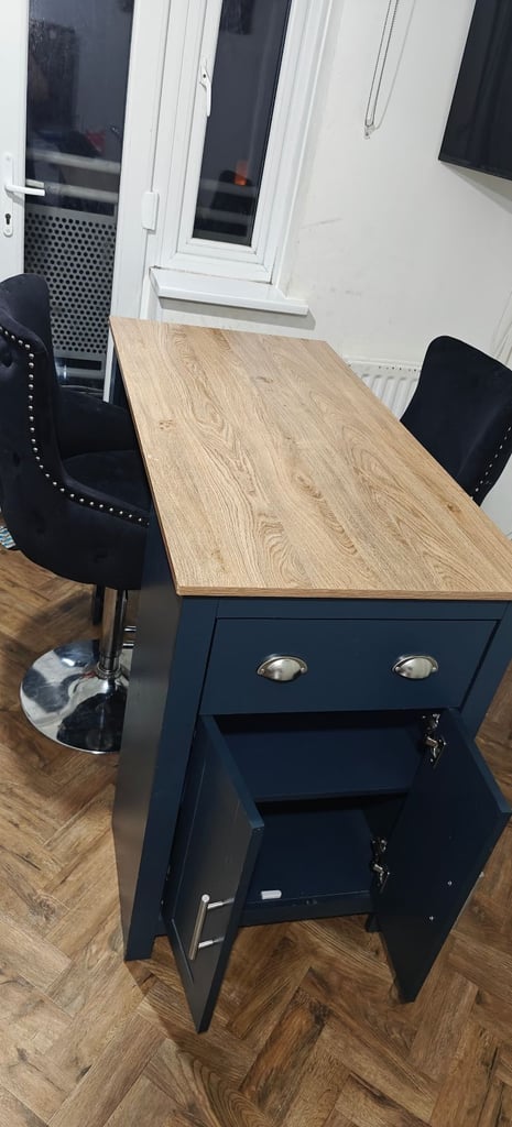 Breakfast bar with two high velvet chairs
