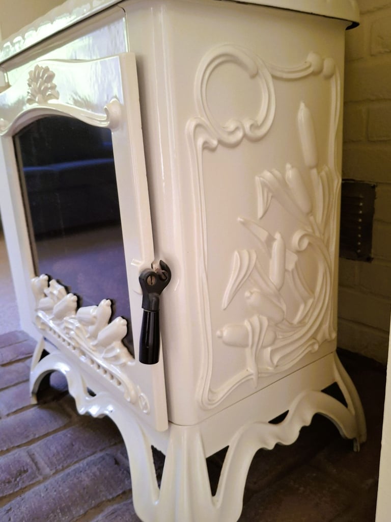Ivory enamel Invicta French woodburner fire. 