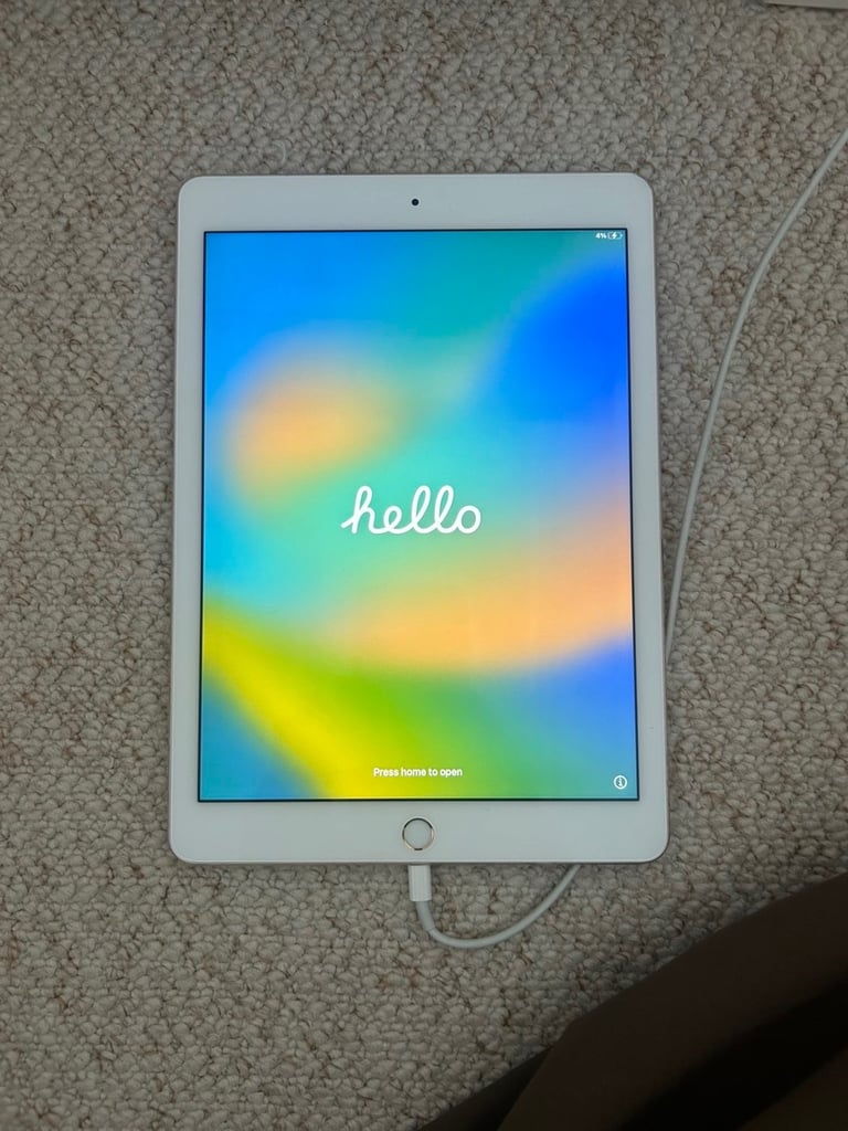 Gold IPad Pro 2016 and charger 