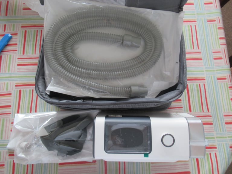 CPAP machine with humidifier, Brand New, with hose holder