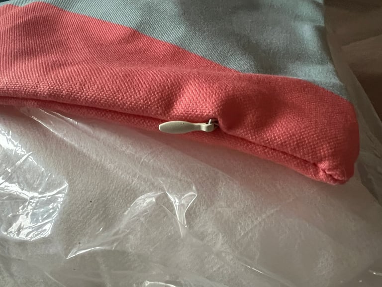 Brand new blue/green and pink/coral square cushion. 