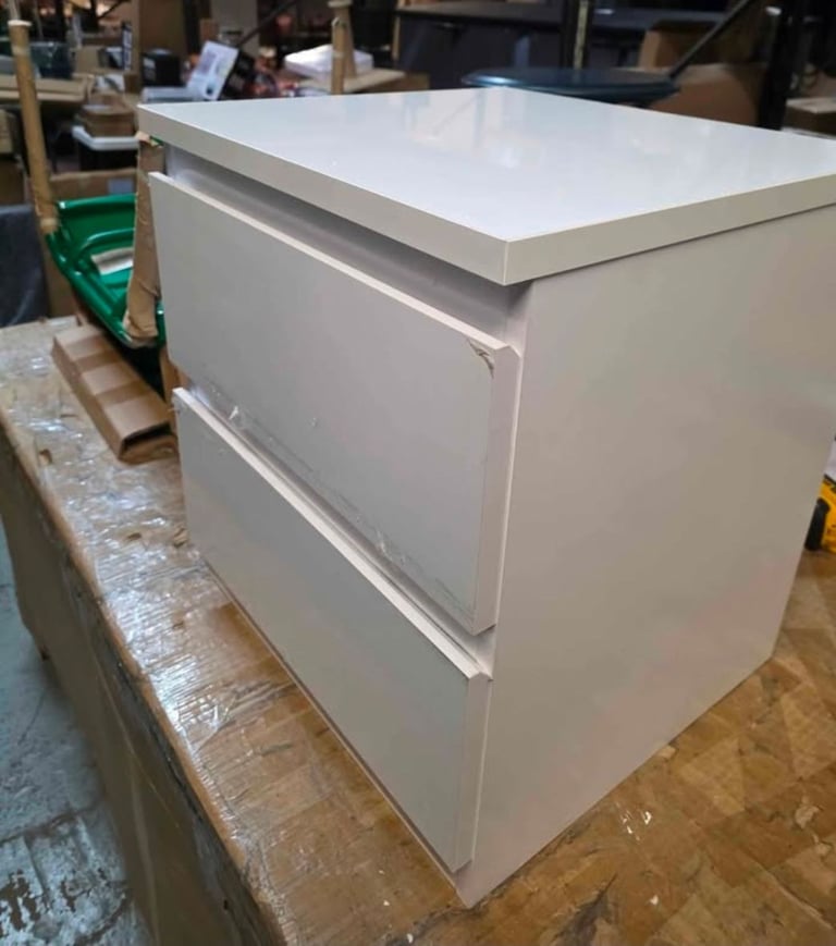 A new pair of large white gloss finish 2 drawer bedside table ( one is .