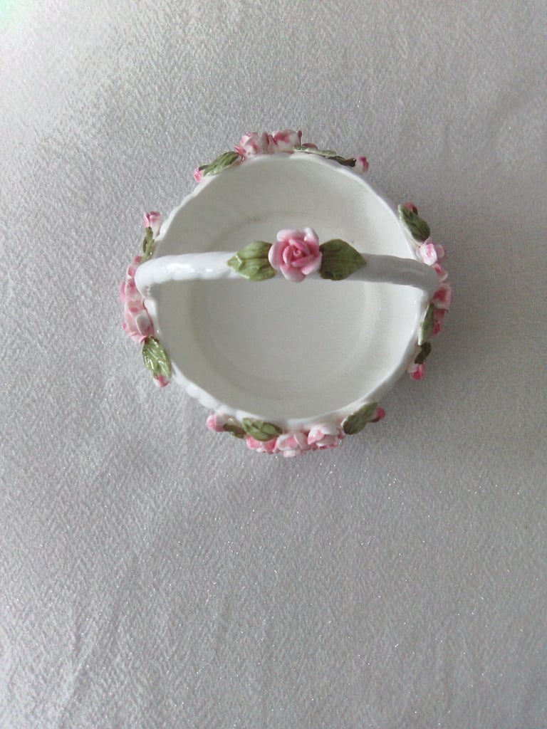Ornate white ceramic with rose and petal detailing, vase and handled bowl set.