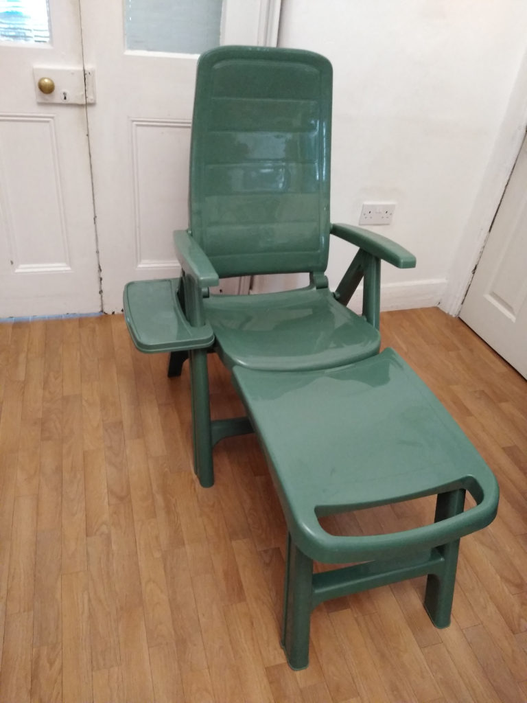 Never used Plastic Green Sun Lounger/ Long Reclining Chair with Removable Footrest and Shelf/ Tray.