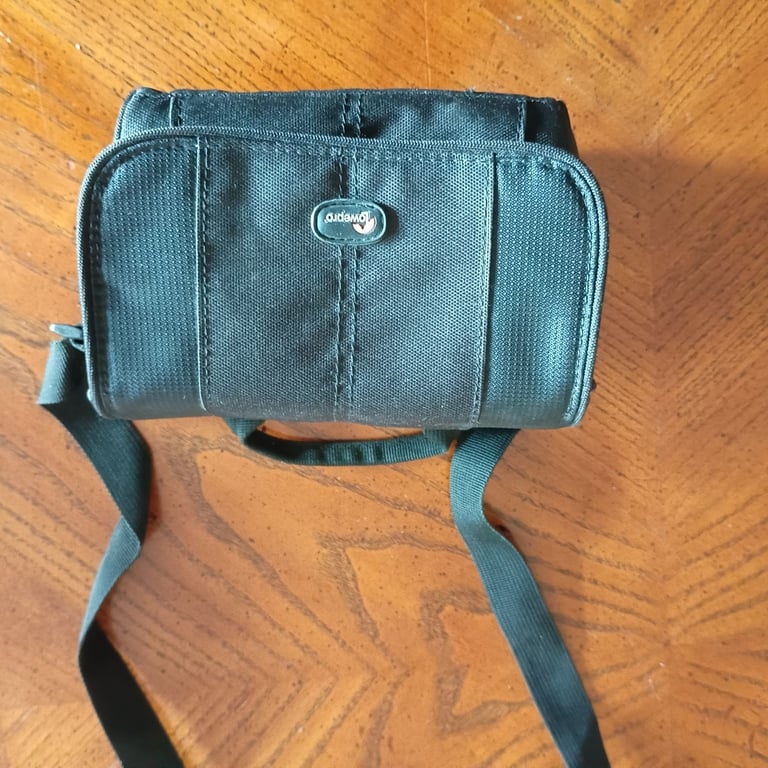 Small Lowepro camera bag with shoulder or waist strap. Waterproof .Black. Ideal for trekking. As new