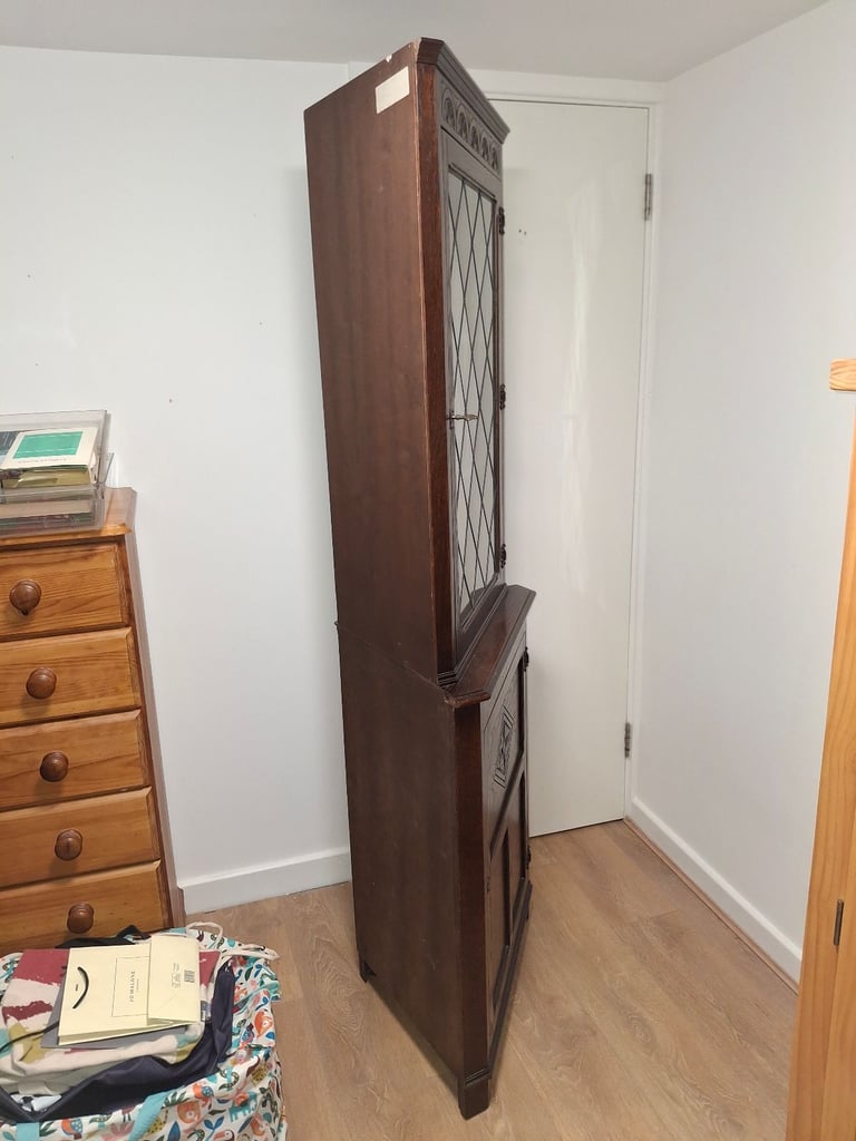 The Jaycee Vintage Oak Corner Display Cabinet is used but in very good condition.