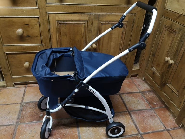 Brio Spin luxury toy pram for dolls & soft toys. Navy blue. Adjustable handle. Great used condition.