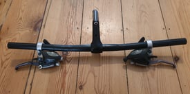 For sale is a pair of Shimano 8x3 shifters and brake levers.