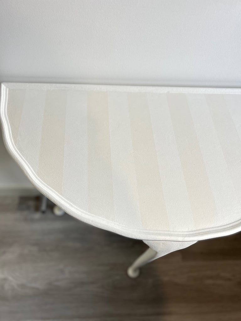 Elegant refinished hall table with ghost stripes