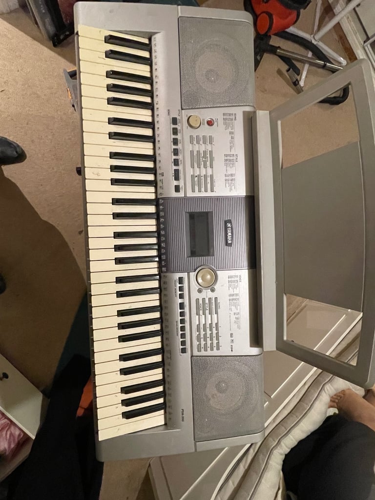 Yamaha keyboard and music stand