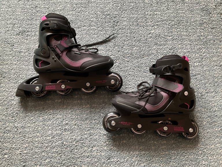 Inline skates used once. Oxelo size 8 Black with pink trim and new ska