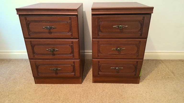 A matching pair of bedside cabinets with 3 drawers in each