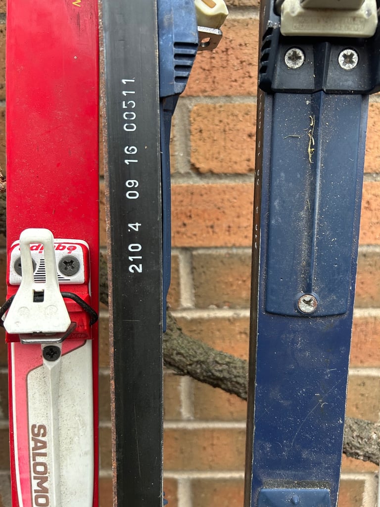 Various cross country skis, poles and boots