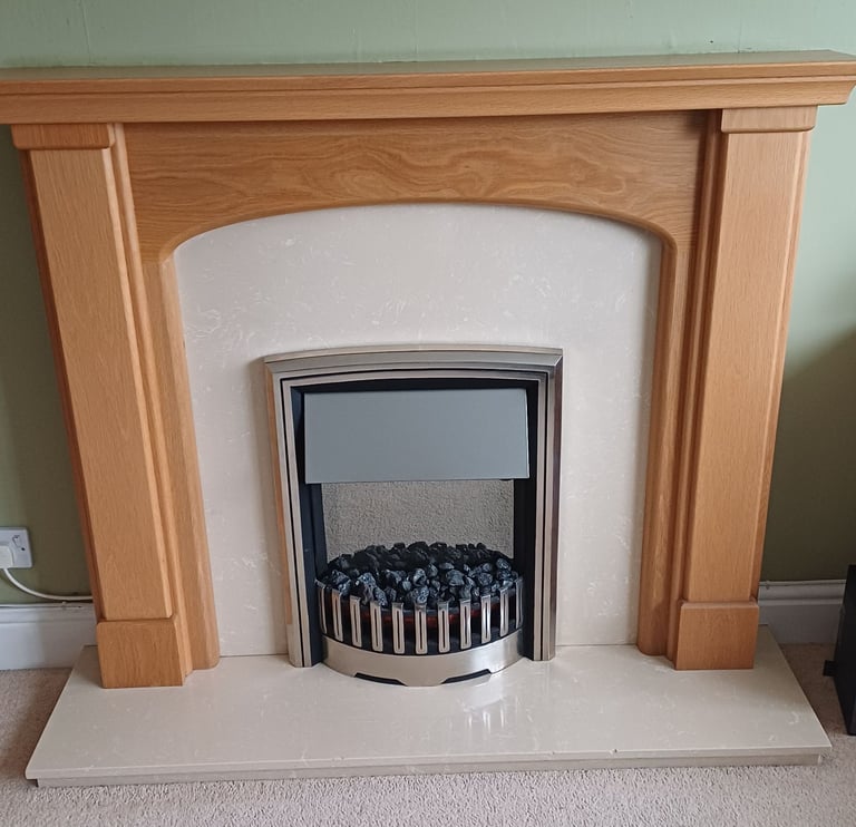 Oak fire surround. Electric fire. Marble hearth.