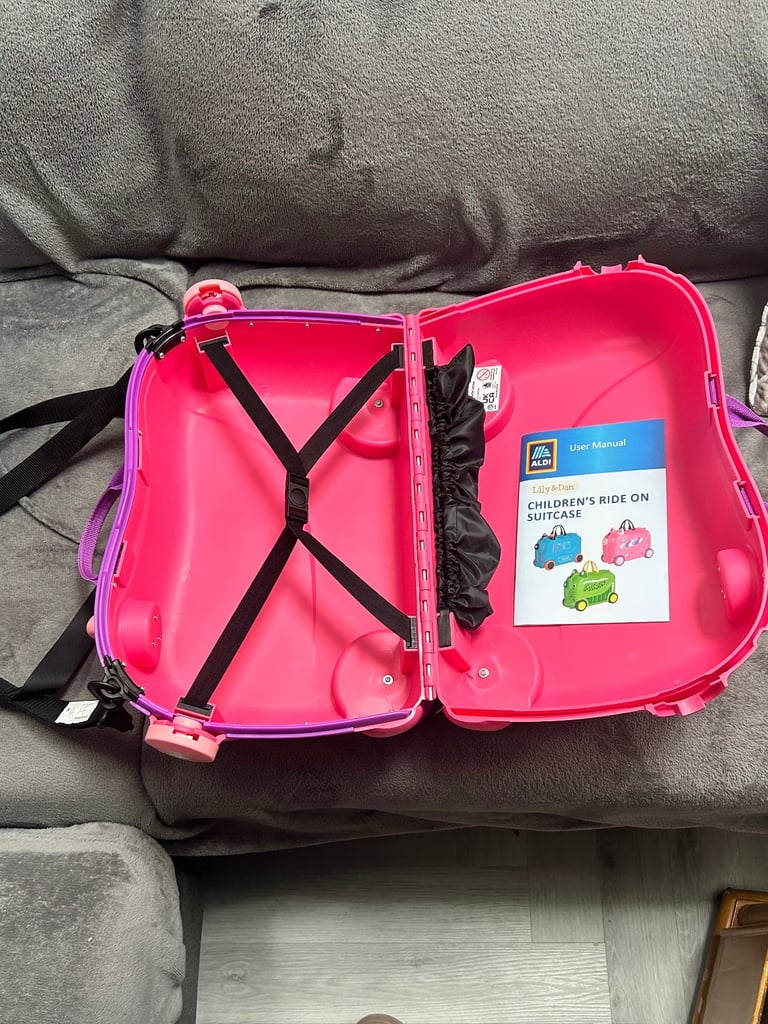 Pink ride on suit case never used 