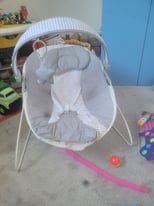 Grey and white baby bouncy chair 