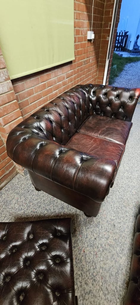Beautiful vintage 2 seater chesterfield sofa with matching footstool.