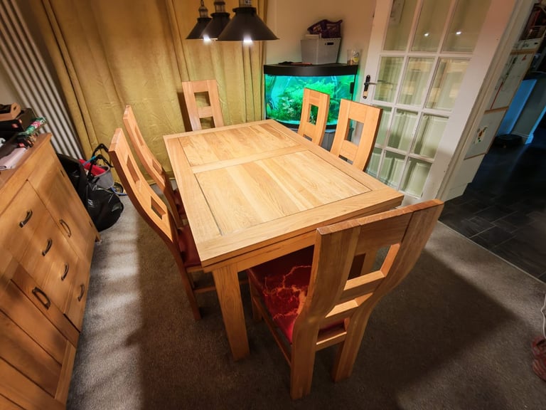 Solid oak extendable dining table, chairs and side board 