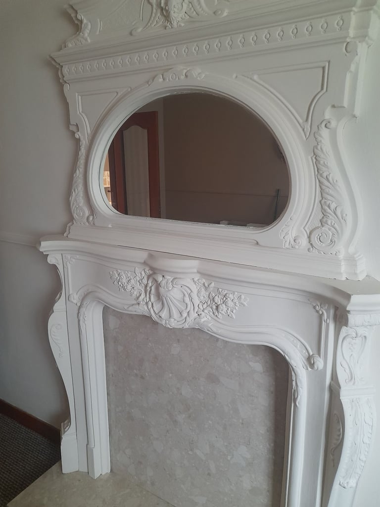 Marble fireplace and marble tables.