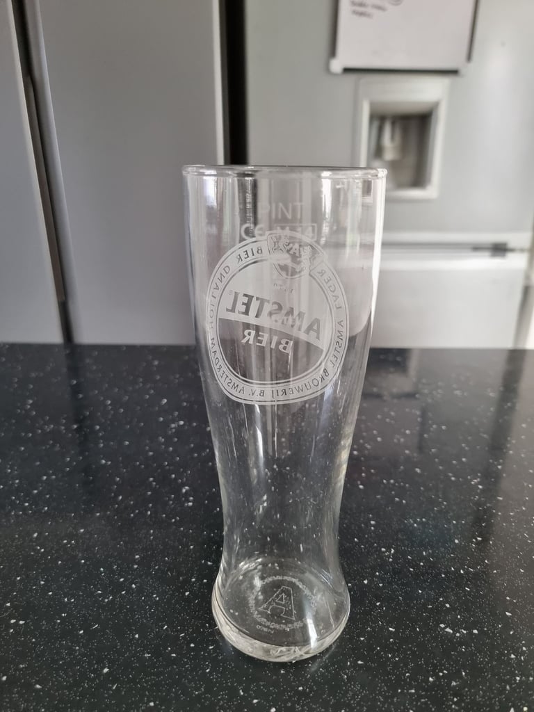 Brand new amstel bier pint glass 
