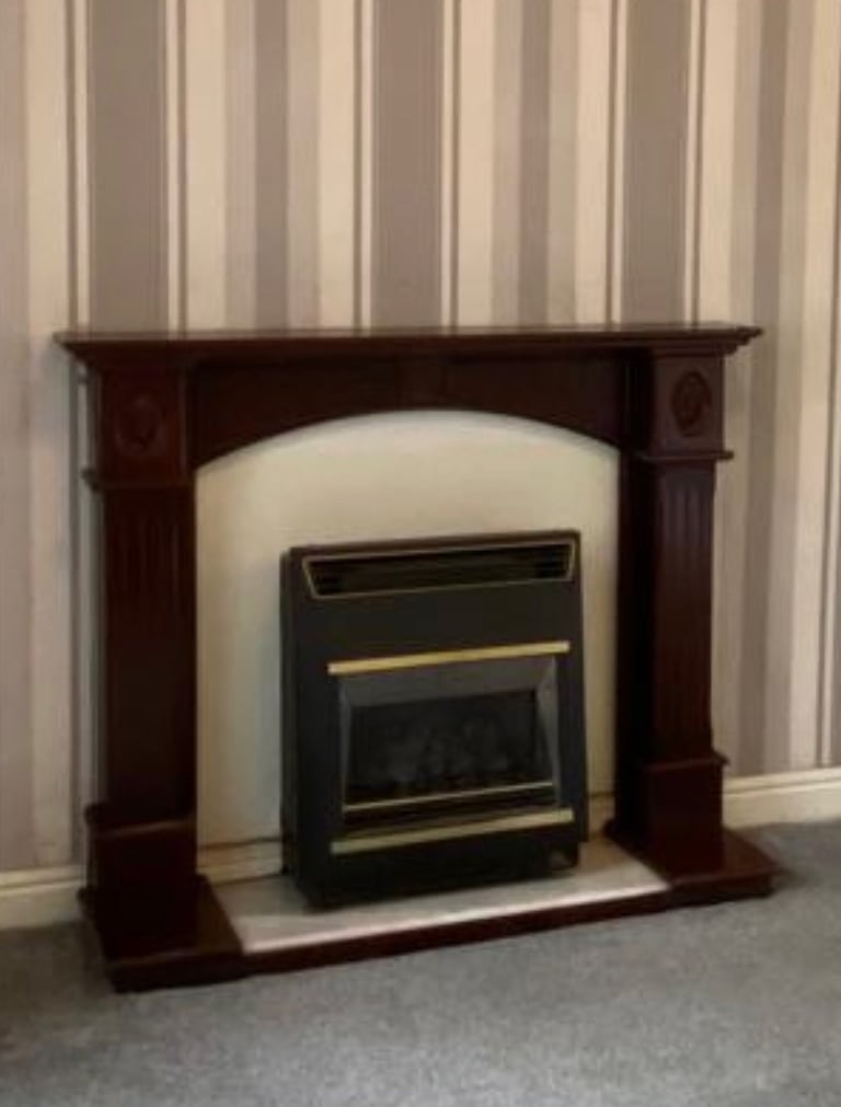 Mahogany colour fireplace and marble hearth. 