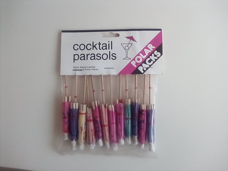 Unopened pack of cocktail glass umbrellas. Glassware.