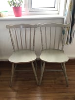 Pair of sturdy wooden chairs pastel green