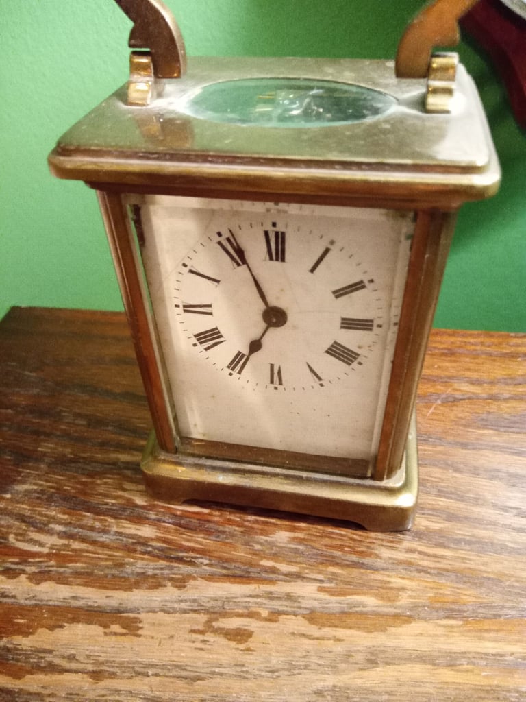 image for Old brass clock, needs attention or useful for spares