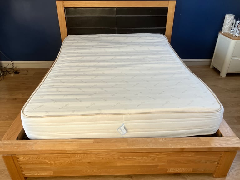 Oak King Size Wooden bed frame with four underbed wheeled drawers 