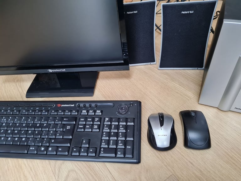 Computer monitor,  keyboard,  mouse and speakers 