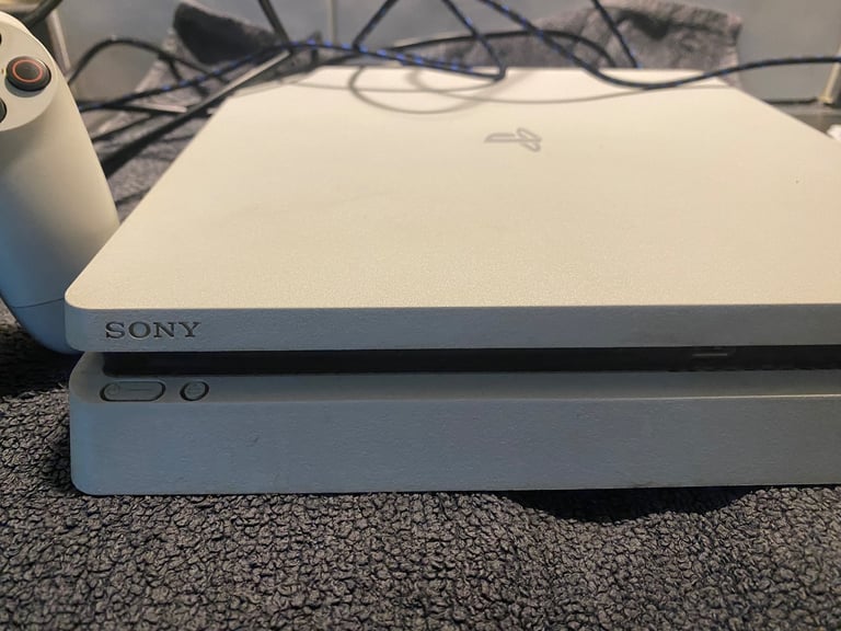 PS4 with 3 games, 1 wireless controller and docking station/charger for controller