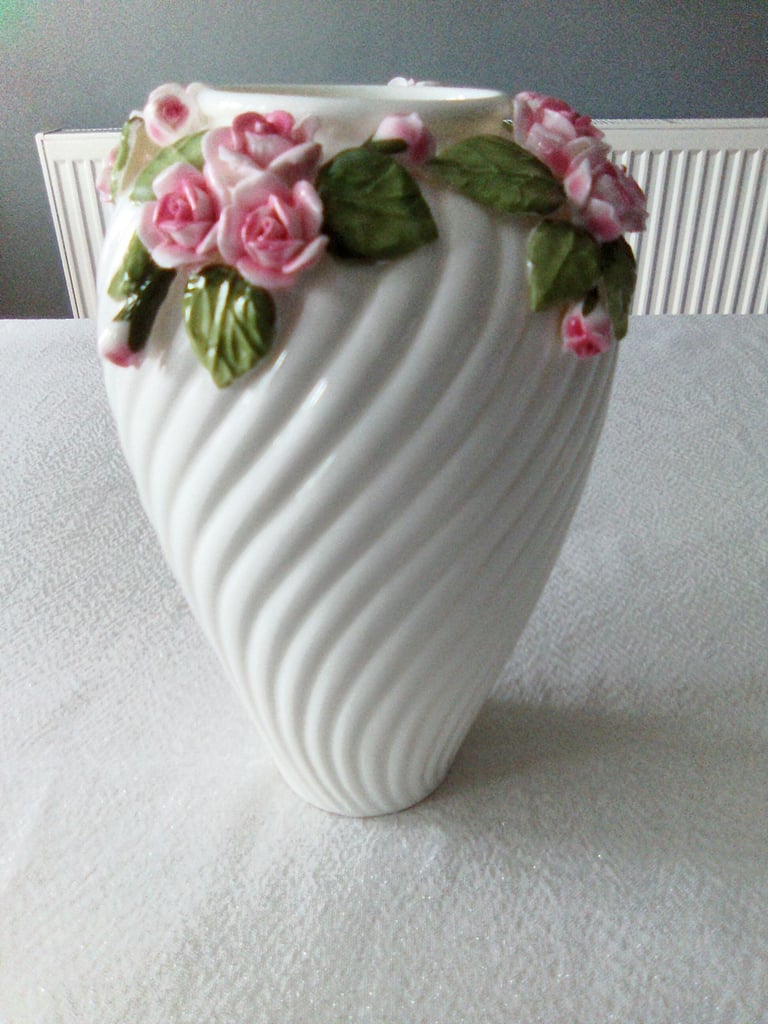 Ornate white ceramic with rose and petal detailing, vase and handled bowl set.