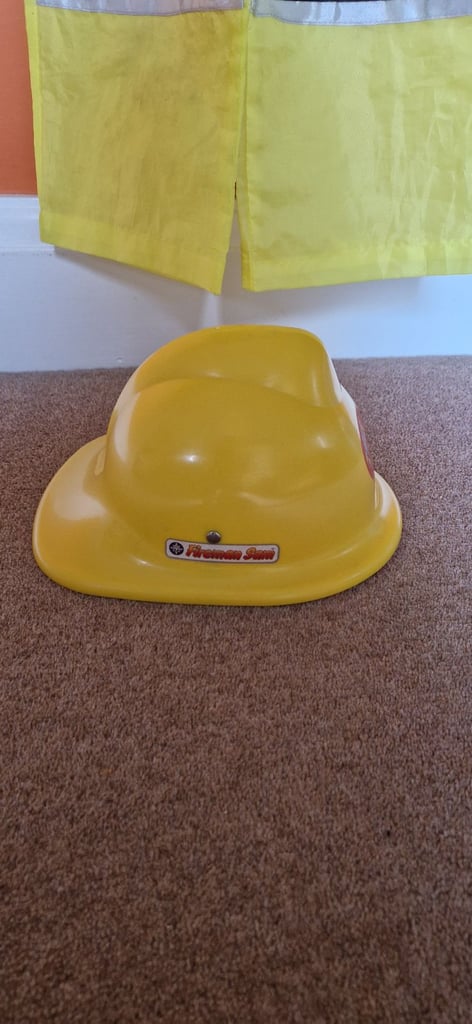 E.L.C FIREFIGHTERS DRESS UP OUTFIT WITH FIREMAN SAM HELMET. VERY GOOD.