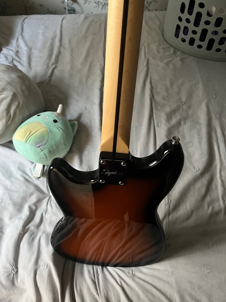 Squier by fender mustang electric guitar in sunburst