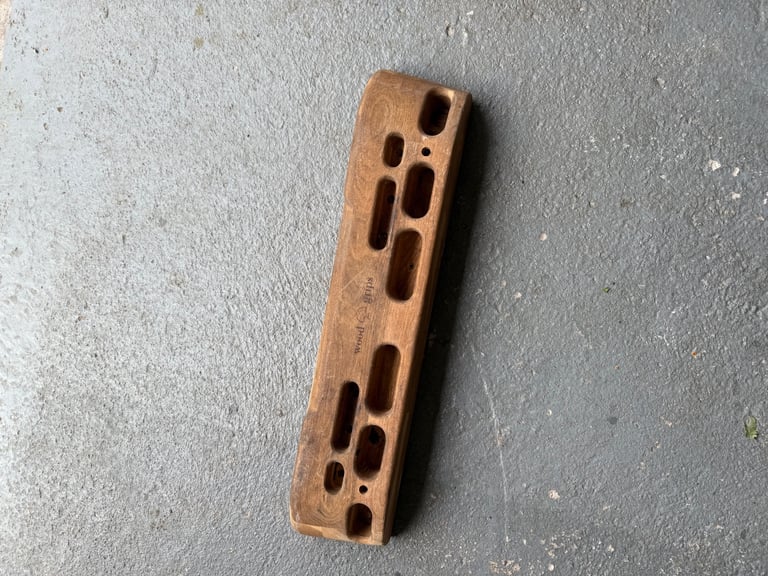 Wood grips rock climbing hold 