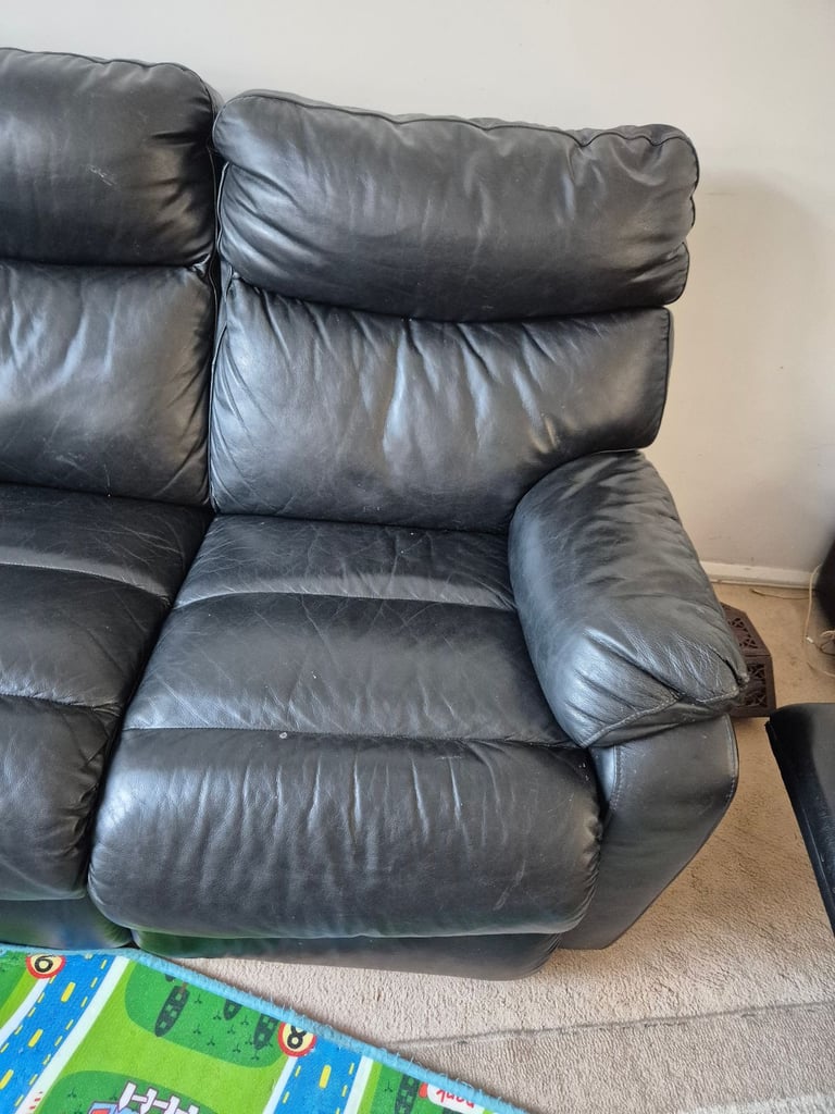Black leather reclining 3 seater sofa 