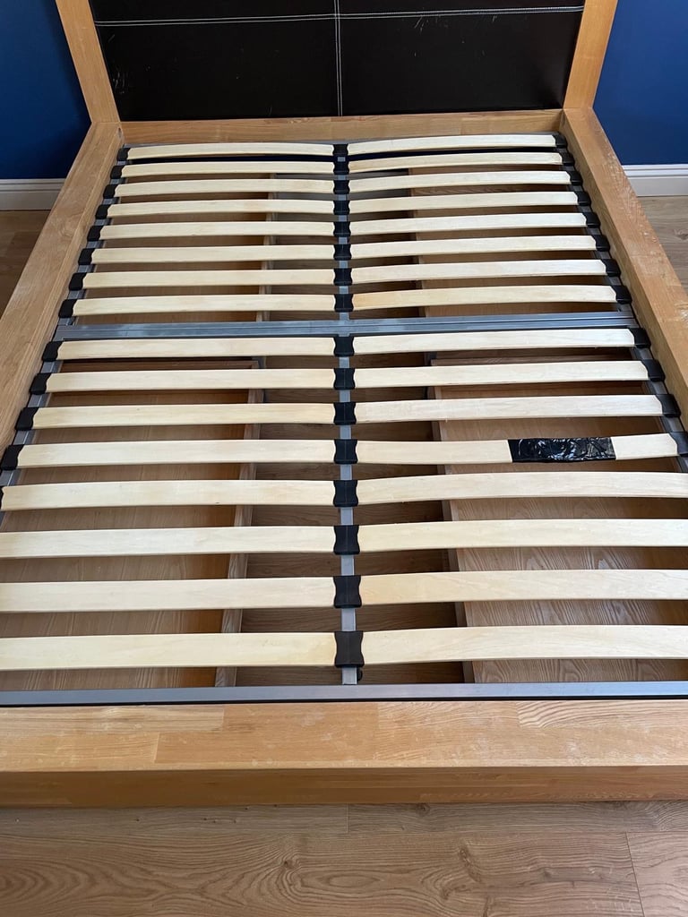 Oak King Size Wooden bed frame with four underbed wheeled drawers 