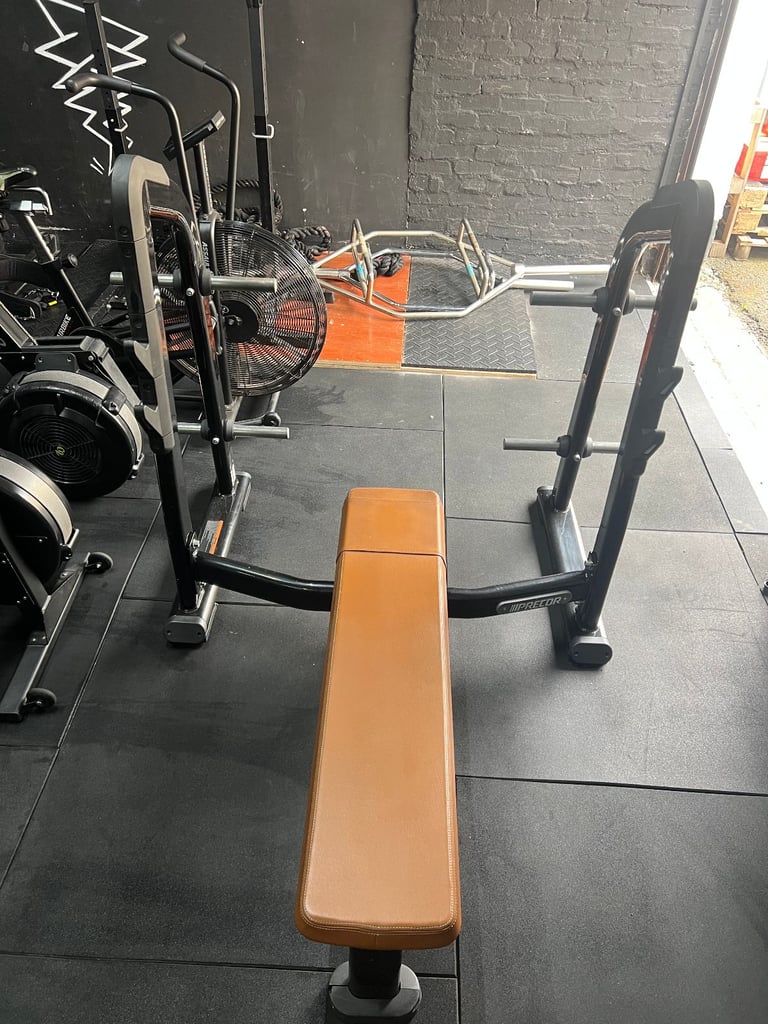 PRECOR Flat Olympic Bench Press with Plate Storage & Brown Leather Finish