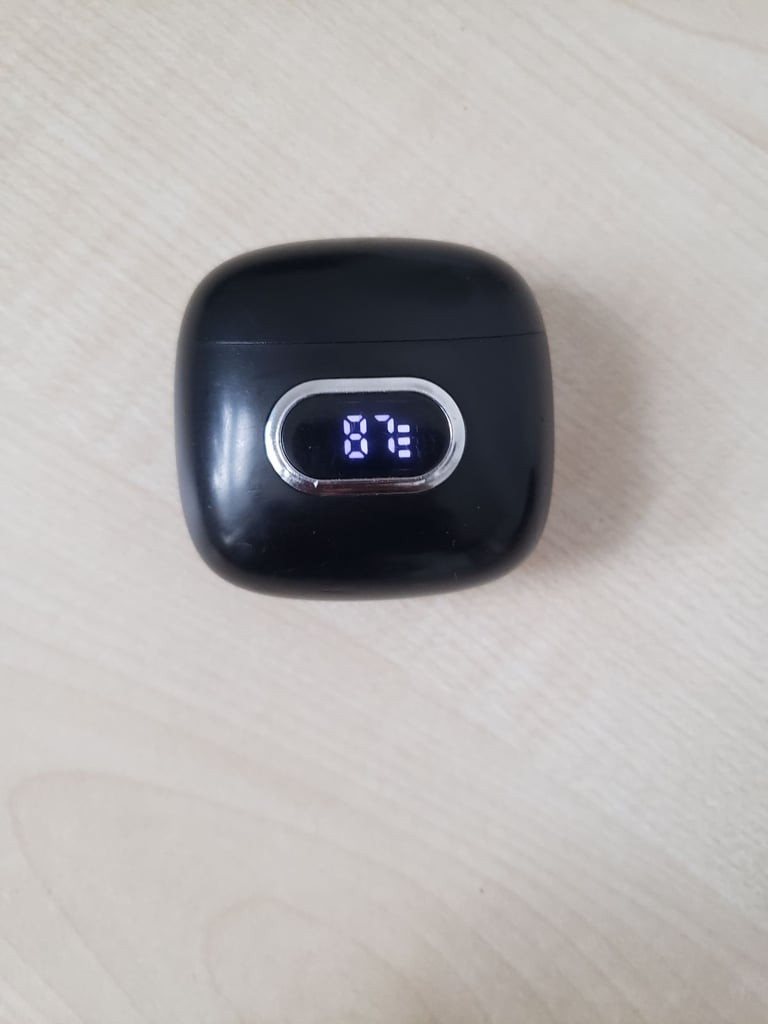 J52 Bluetooth earbuds with a digital display indicating the battery level.